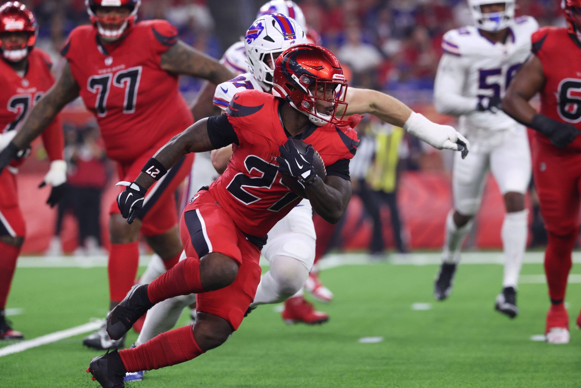 Houston Texans running back Woody Marks (27) runs against the Buffalo Bills in the second half at NRG Stadium.