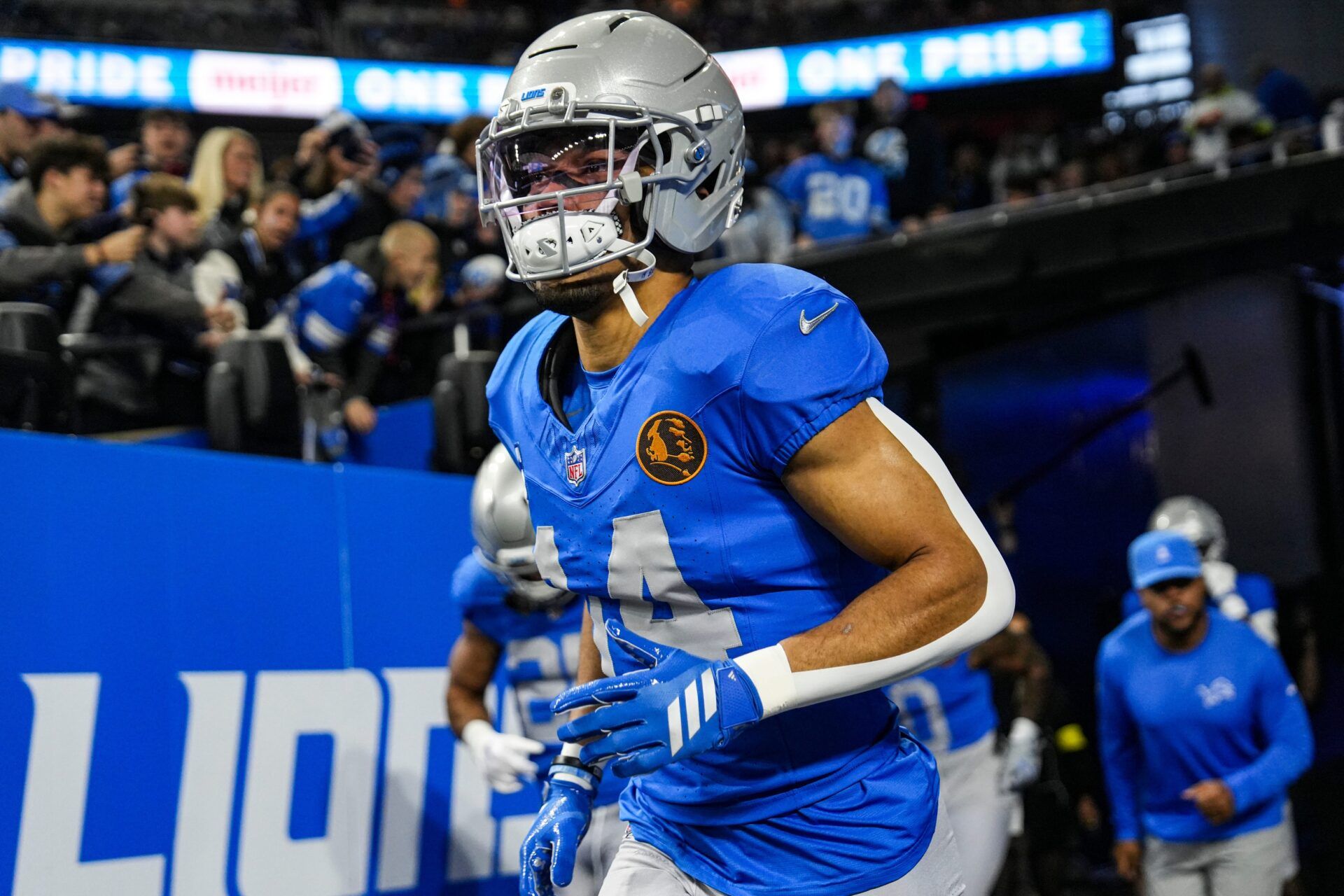 Detroit Lions wide receiver Amon-Ra St. Brown (14) runs onto the field for warmup ahead of the Green Bay Packers game at Ford Field in Detroit on Thursday, Nov. 27, 2025.