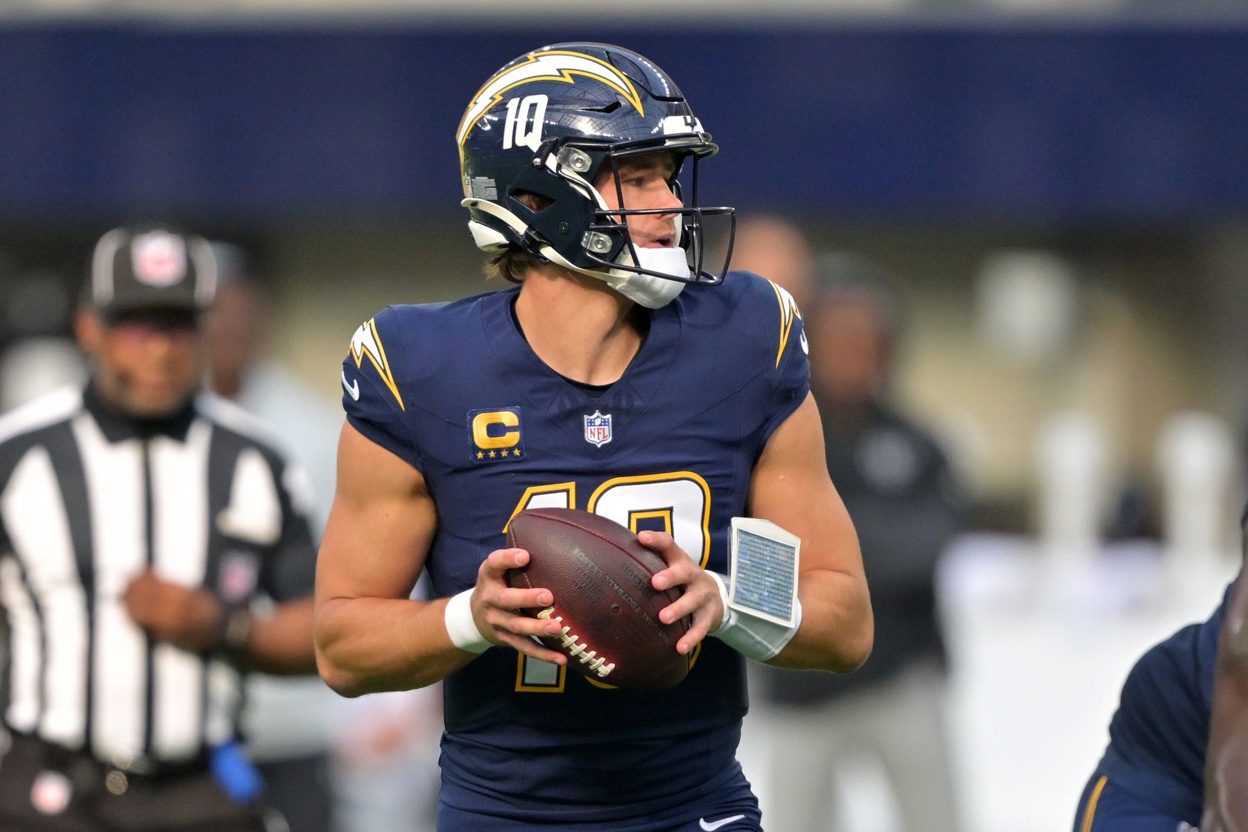 Los Angeles Chargers quarterback Justin Herbert (10) drops back to pass against the Las Vegas Raiders during the first half at SoFi Stadium.