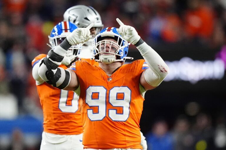 Denver Broncos defensive end Zach Allen (99) reacts against the Las Vegas Raiders during the first half at Empower Field at Mile High.