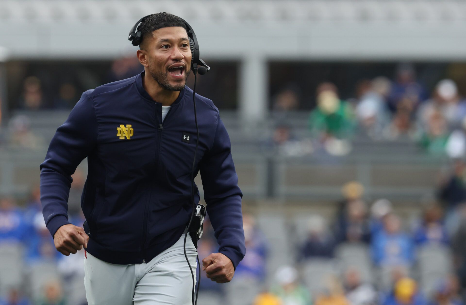 Notre Dame Fighting Irish head coach Marcus Freeman reacts after an Irish touchdown against the Pittsburgh Panthers during the second quarter at Acrisure Stadium.