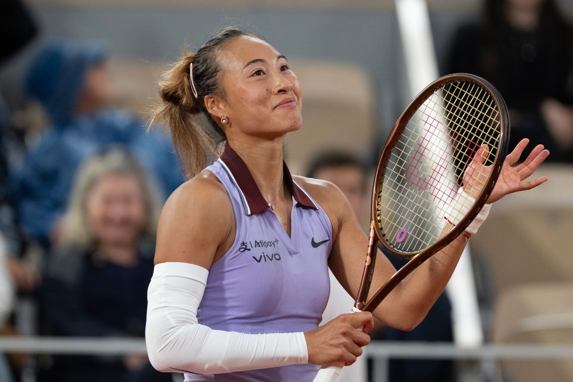 Chinese star Zheng Qinwen unveils her stunning looks as she stars for Vogue China's December issue, highlighting her fashionistic flair.