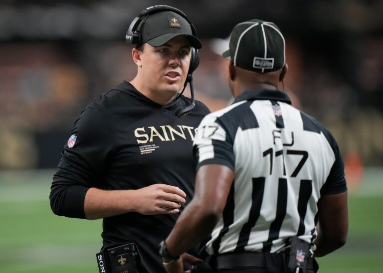 New Orleans Saints head coach Kellen Moore talks to a referee against the New York Giants during the second quarter at Caesars Superdome.