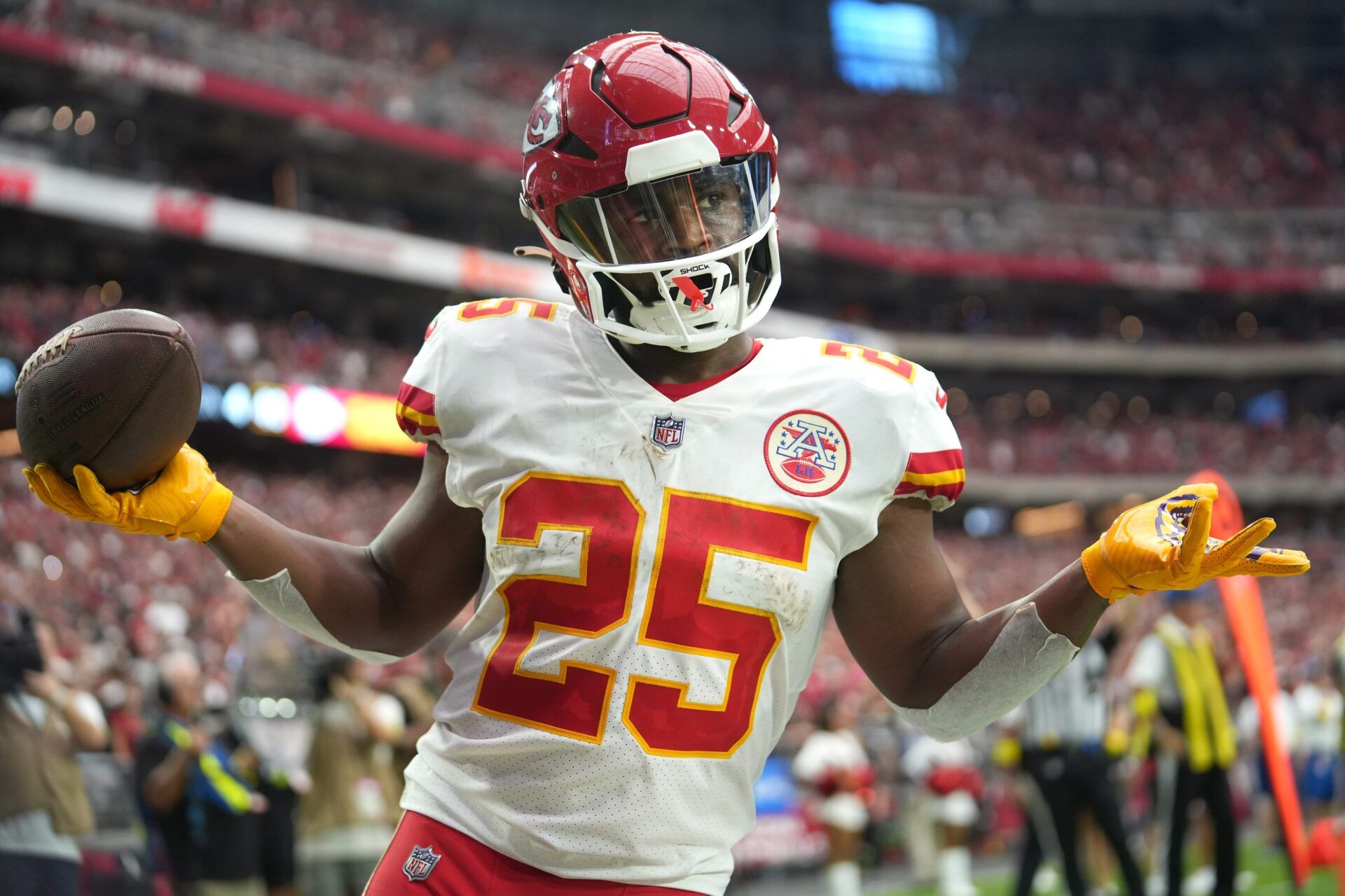 Glendale, Arizona, United States; Kansas City Chiefs running back Clyde Edwards-Helaire (25) shrugs as he walks into the end zone untouched for a score against the Arizona Cardinals at State Farm Stadium.