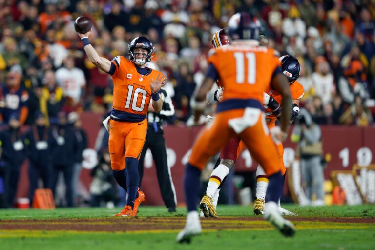 Denver Broncos quarterback Bo Nix (10) passes the ball against the Washington Commanders in the second quarter of the game at Northwest Stadium.