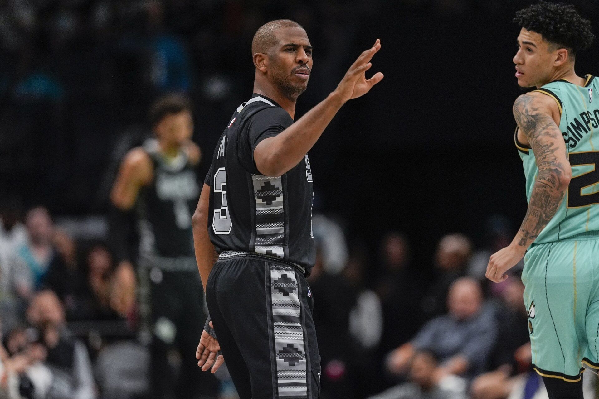San Antonio Spurs guard Chris Paul (3) reacts to a play during the second quarter against the Charlotte Hornets at Spectrum Center.