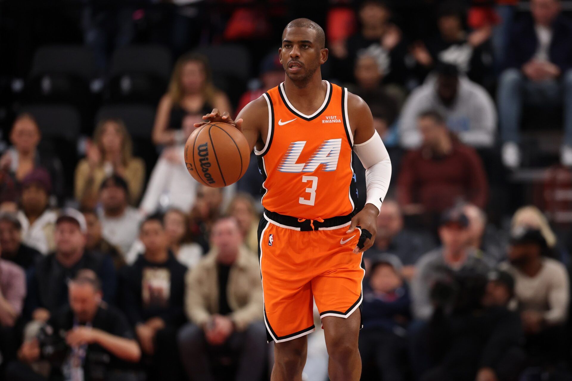 Los Angeles Clippers guard Chris Paul (3) brings the ball up court during the first quarter against the Dallas Mavericks at Intuit Dome.
