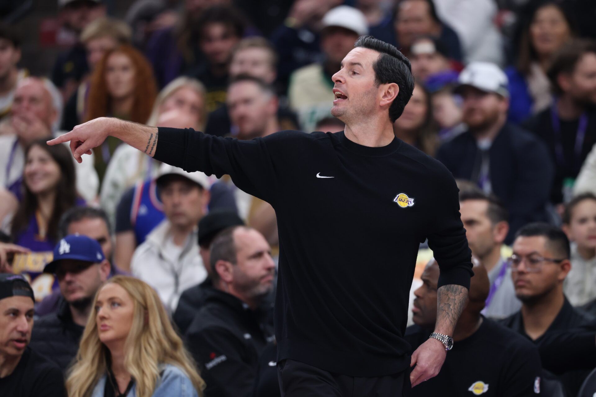 Los Angeles Lakers head coach JJ Redick gives instructions during the first half of the game against the Utah Jazz at Delta Center.