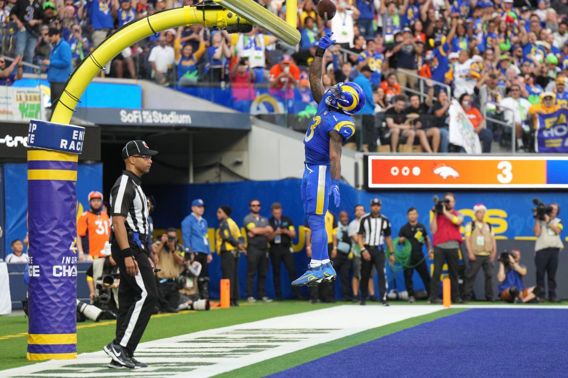 Los Angeles Rams running back Cam Akers (3) celebrates after scoring on a 2-yard touchdown run against the Denver Broncos in the first half at SoFi Stadium.