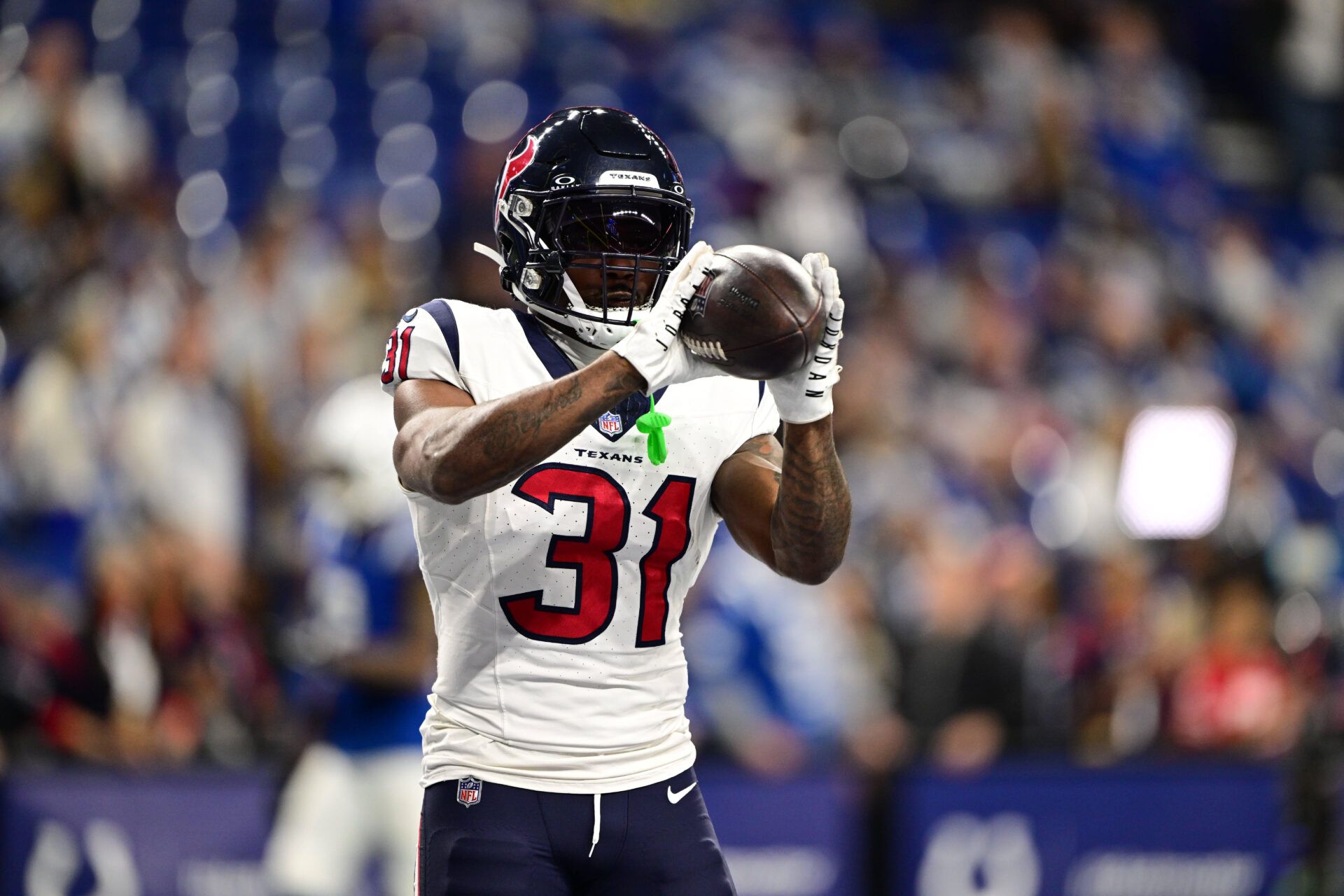 Houston Texans running back Dameon Pierce (31) catches a pass during warm ups before a game against the Indianapolis Colts at Lucas Oil Stadium.
