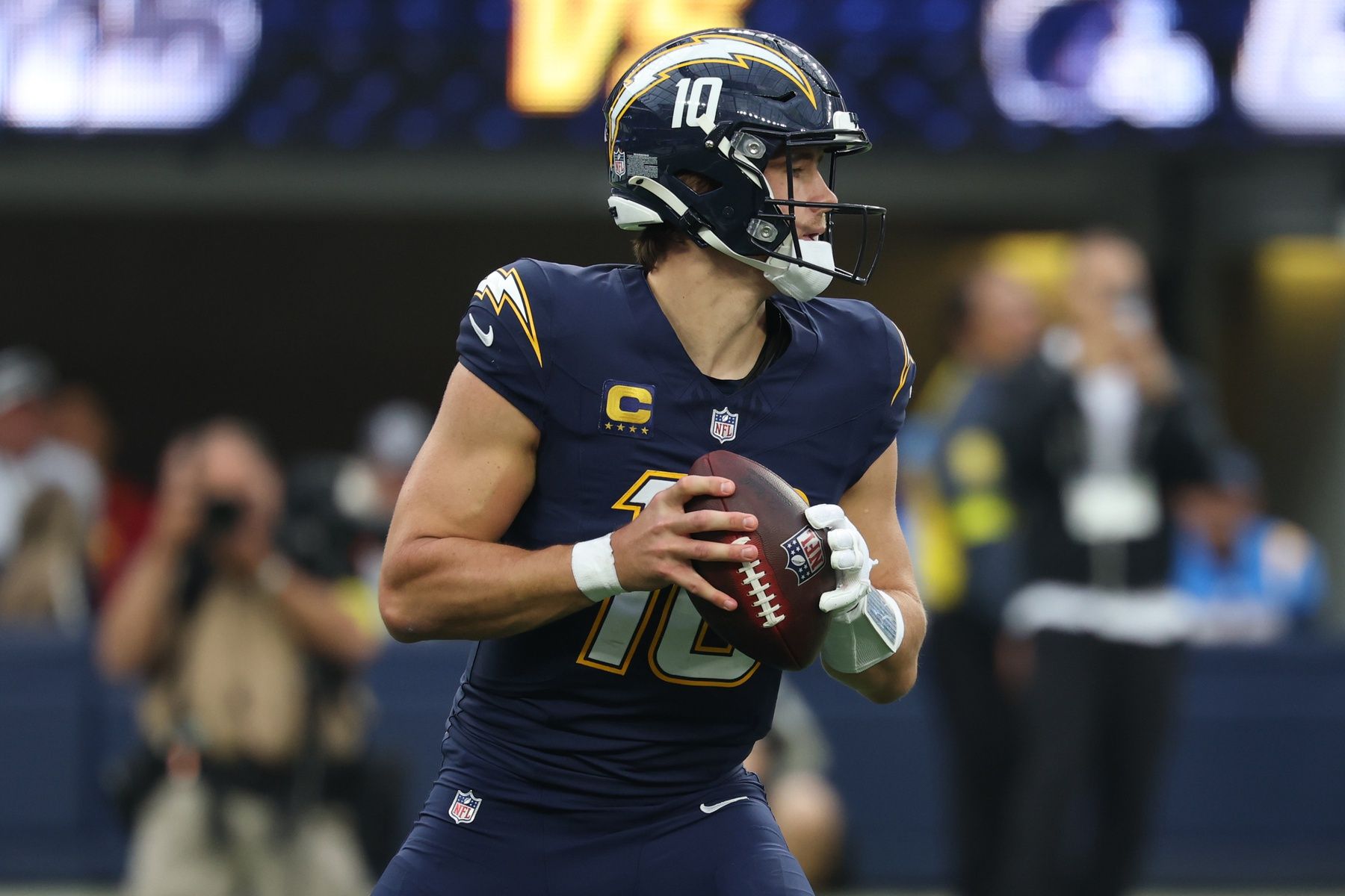 Los Angeles Chargers quarterback Justin Herbert (10) drops back to pass against the Las Vegas Raiders during the second half at SoFi Stadium.