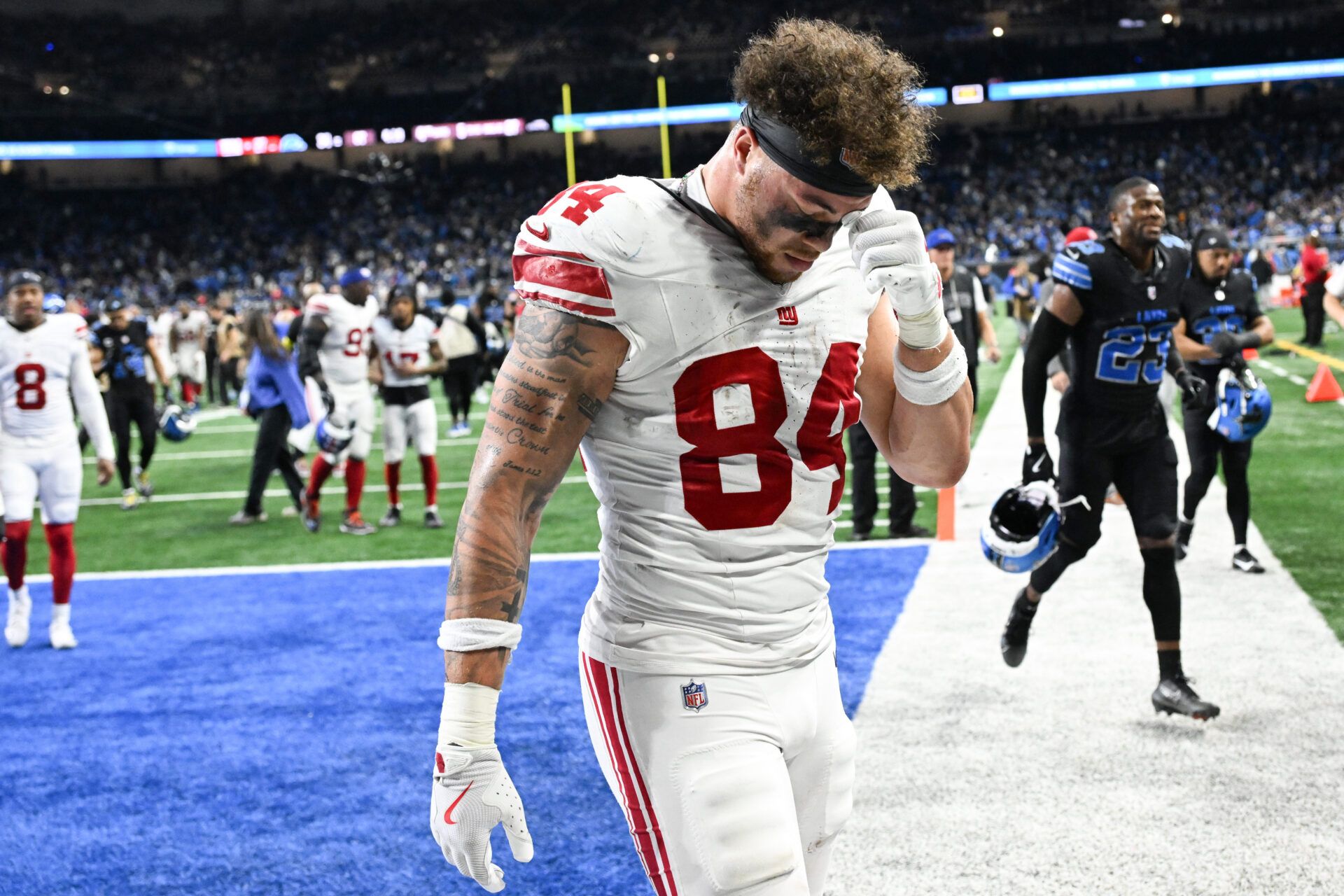 New York Giants tight end Theo Johnson (84) walks the field after the game against the Detroit Lions at Ford Field.