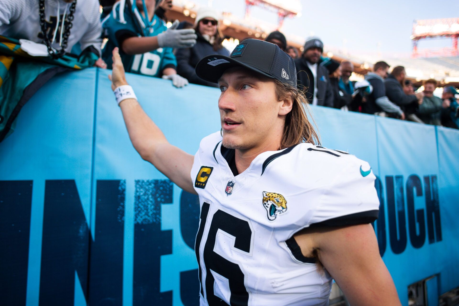 Jacksonville Jaguars quarterback Trevor Lawrence (16) high fives the fans against the Tennessee Titans during the second half at Nissan Stadium.