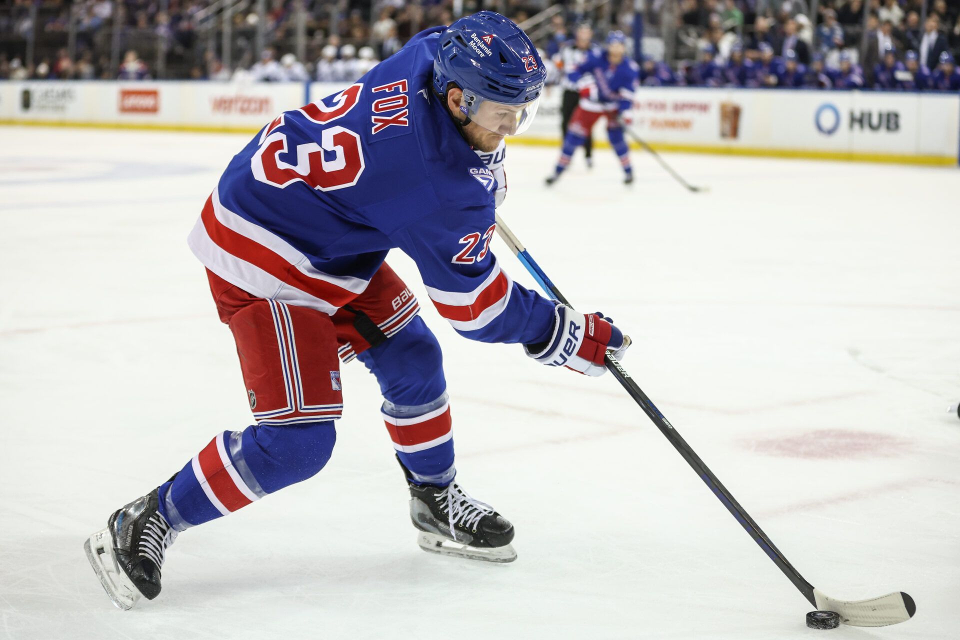 New York Rangers defenseman Adam Fox (23) controls the puck in the second period against the Tampa Bay Lightning at Madison Square Garden.