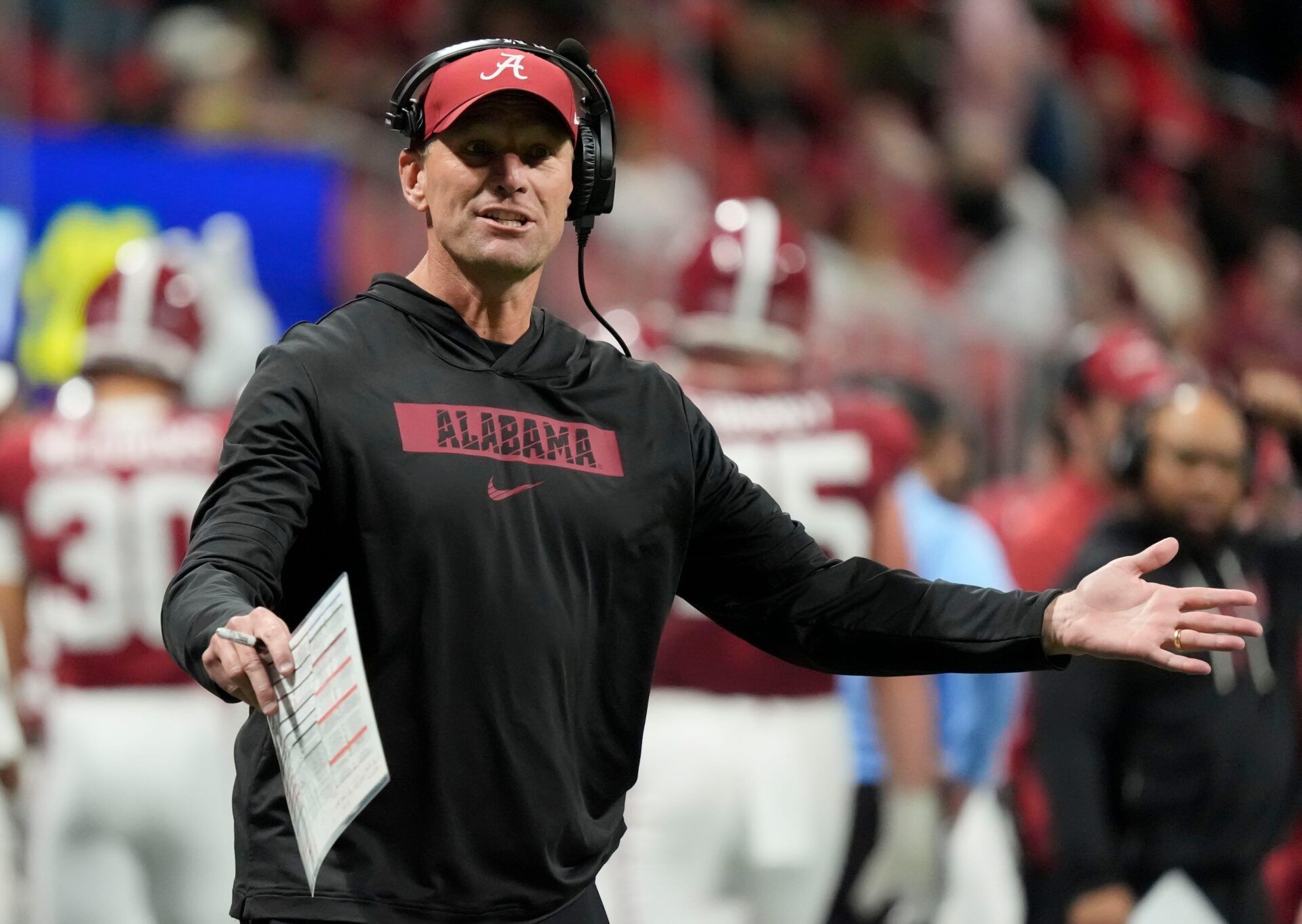Alabama head coach Kalen DeBoer gestures on the sidelines after a dropped pass in the end zone against Georgia at Mercedes-Benz Stadium.