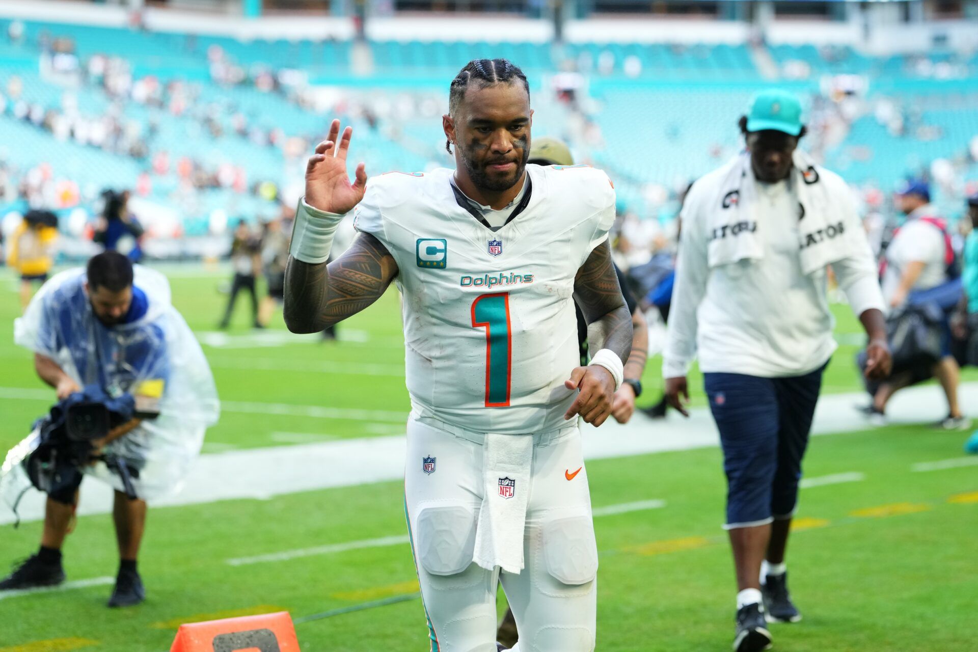 Miami Dolphins quarterback Tua Tagovailoa (1) leaves the field following a game against the New Orleans Saints at Hard Rock Stadium.