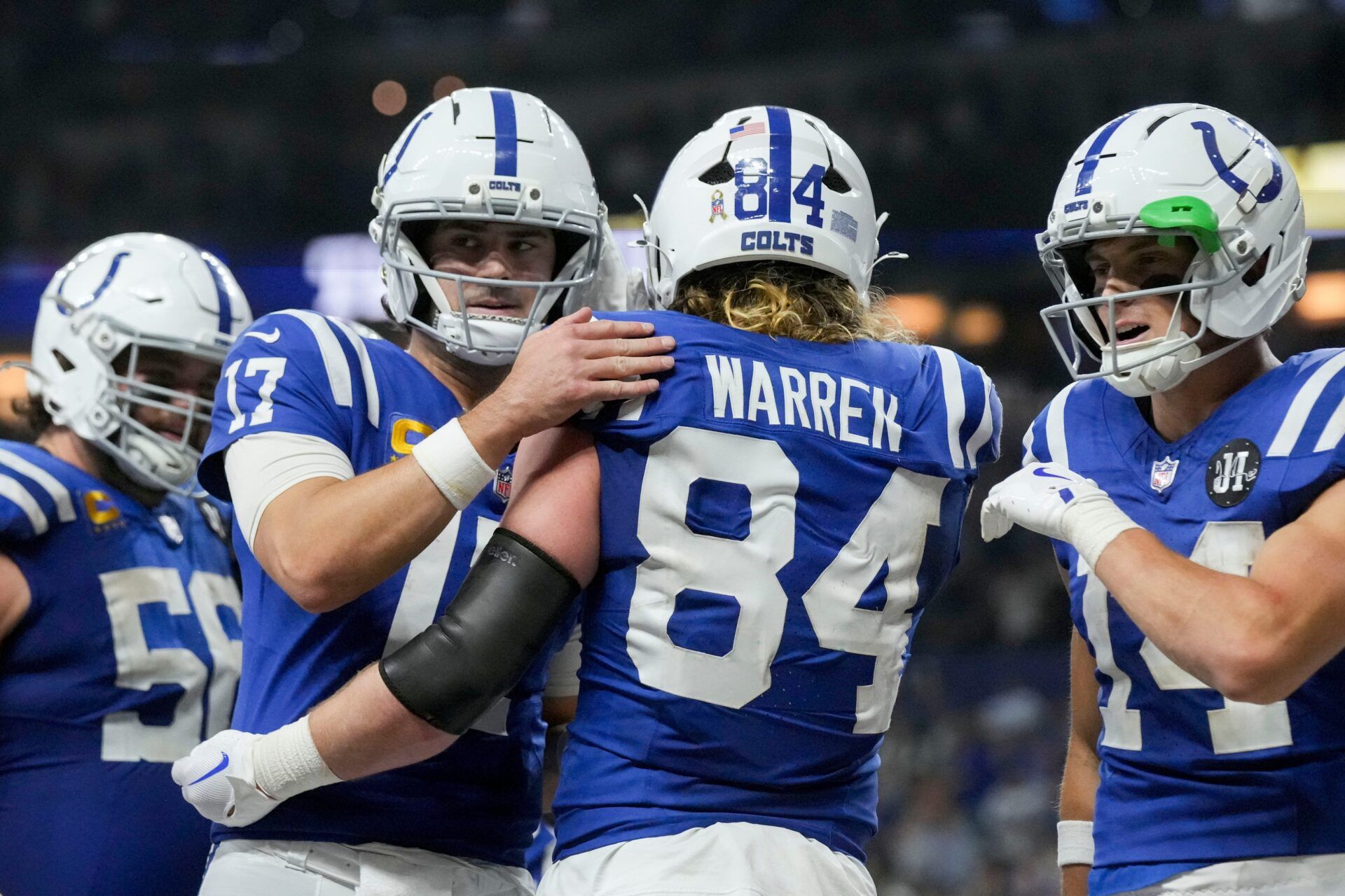 Indianapolis Colts tight end Tyler Warren (84) celebrates with his teammates after scoring a touchdown Sunday, Nov. 30, 2025, during a game against the Houston Texans at Lucas Oil Stadium in Indianapolis.