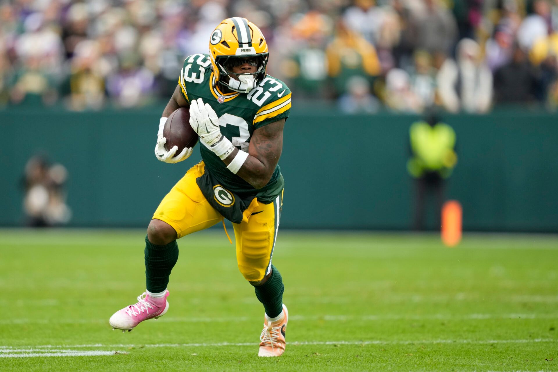 Green Bay Packers running back Emanuel Wilson (23) carries the ball against the Minnesota Vikings during the first half at Lambeau Field.