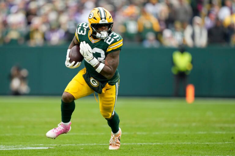 Green Bay Packers running back Emanuel Wilson (23) carries the ball against the Minnesota Vikings during the first half at Lambeau Field.