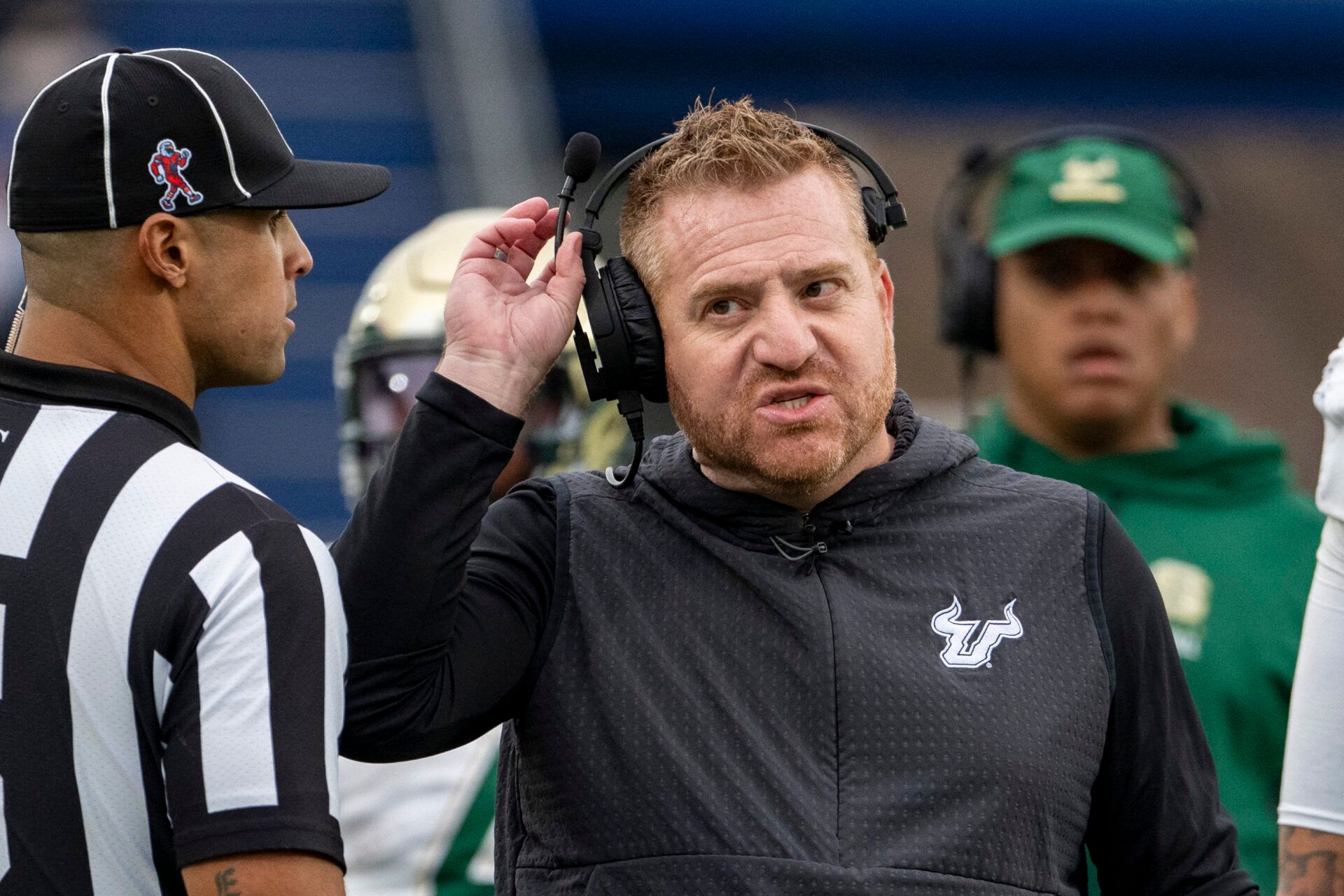 South Florida Bulls head coach Alex Golesh speaks with  an official on the  sidelines during the second half against the Navy Midshipmen at Navy-Marine Corps Memorial Stadium. Navy Midshipmen defeated South Florida Bulls 41-28.