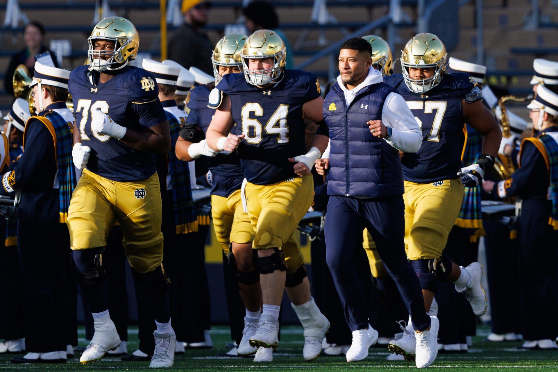 Notre Dame head coach Marcus Freeman takes the field with his players before a NCAA football game against Syracuse at Notre Dame Stadium on Saturday, Nov. 22, 2025, in South Bend.