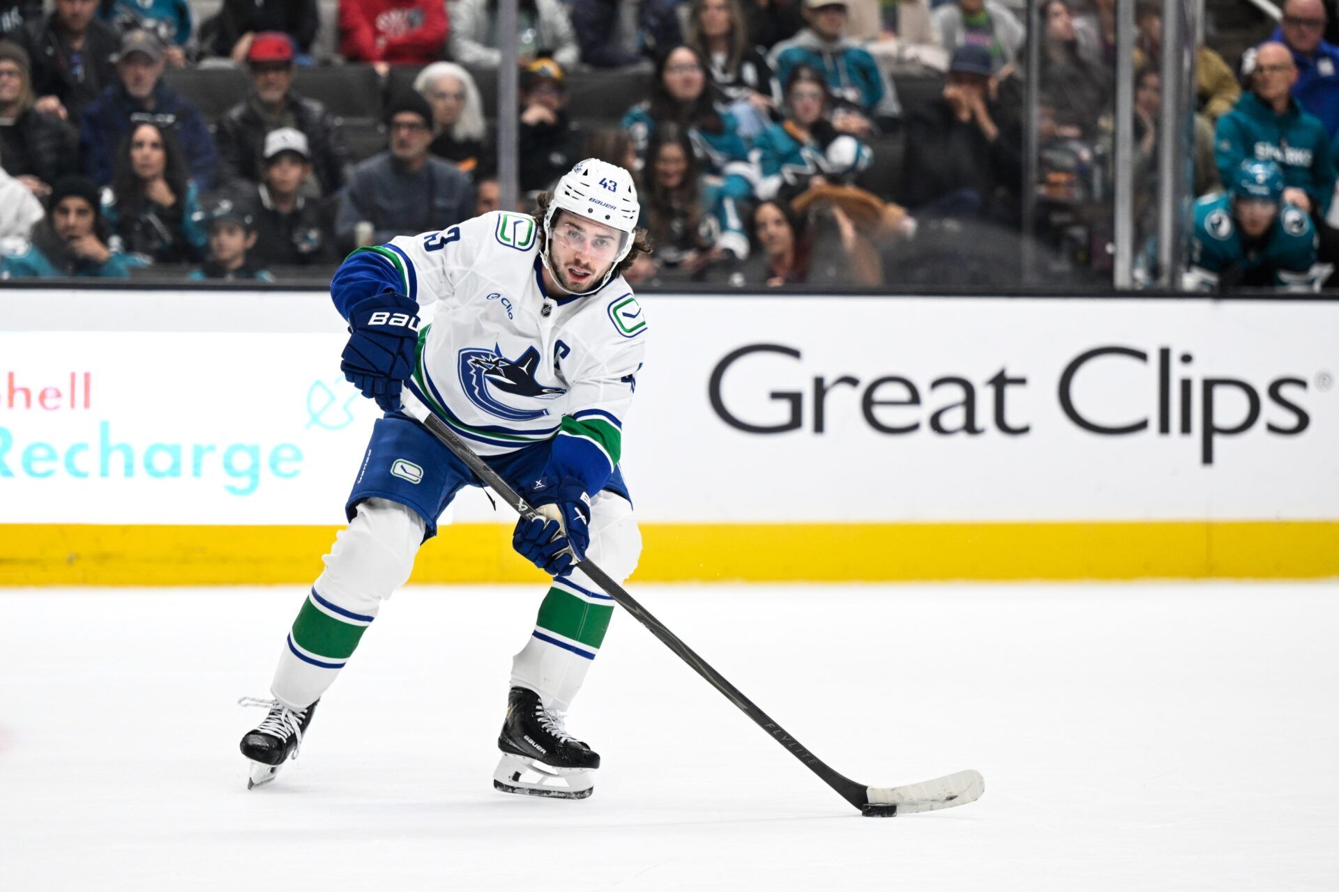 Vancouver Canucks defenseman Quinn Hughes (43) controls the puck against the San Jose Sharks in the third period at SAP Center at San Jose.
