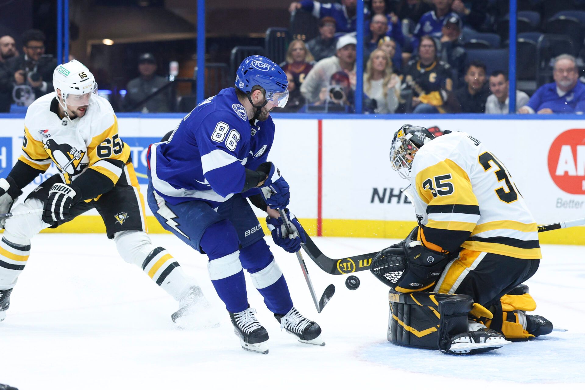 Pittsburgh Penguins goaltender Tristan Jarry (35) makes a save on a shot from Tampa Bay Lightning right wing Nikita Kucherov (86) in the third period  at Benchmark International Arena.