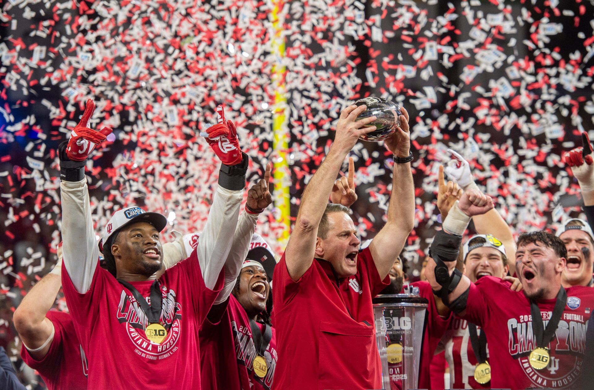 Indiana Head Coach Curt Cignetti and the Hoosiers celebrate after the Indiana versus Ohio State Big Ten Championship football game at Lucas Oil Stadium on Saturday, Dec. 6, 2025.