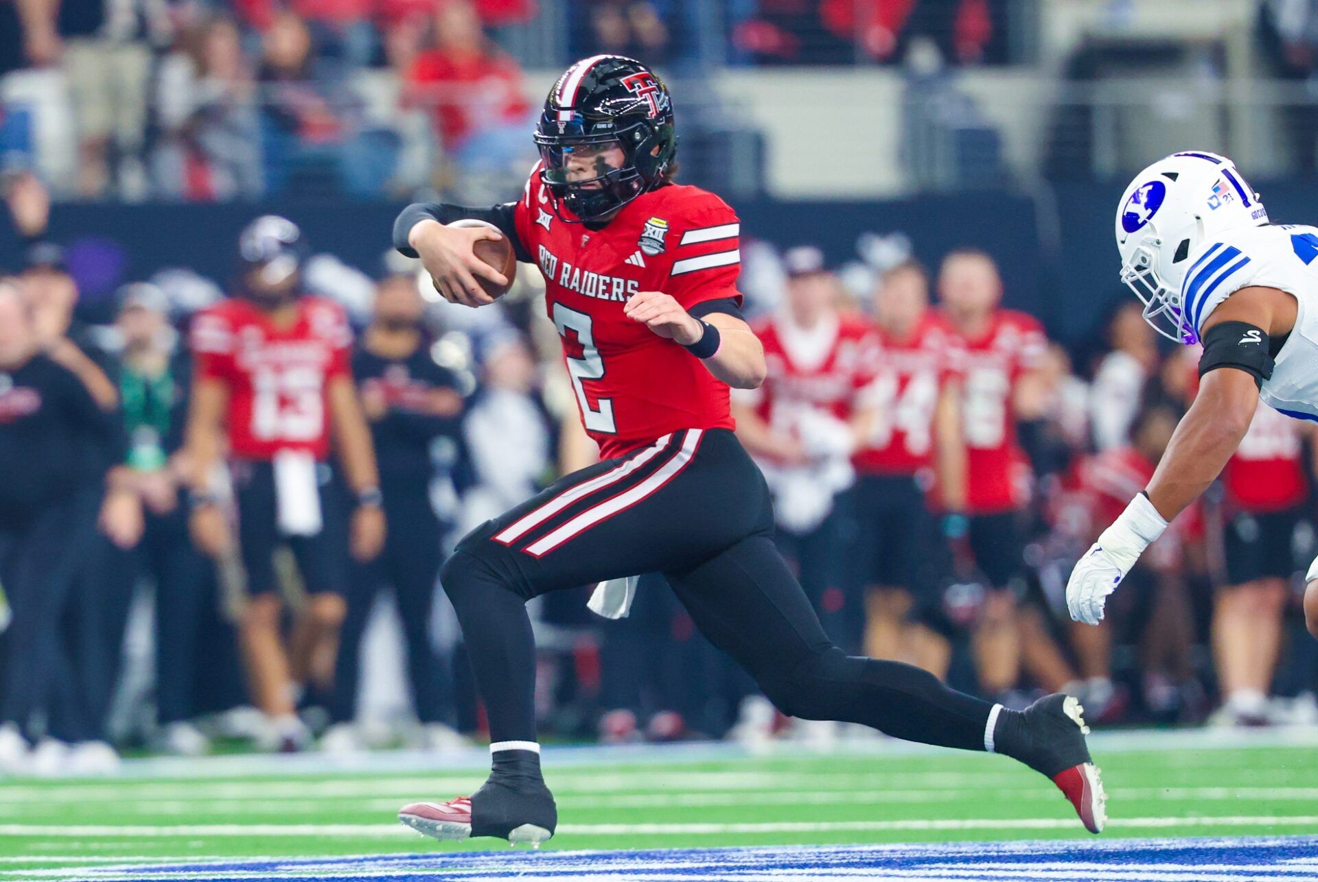 Texas Tech Red Raiders quarterback Behren Morton (2) runs with the ball during the second quarter against the BYU Cougars at AT&T Stadium.
