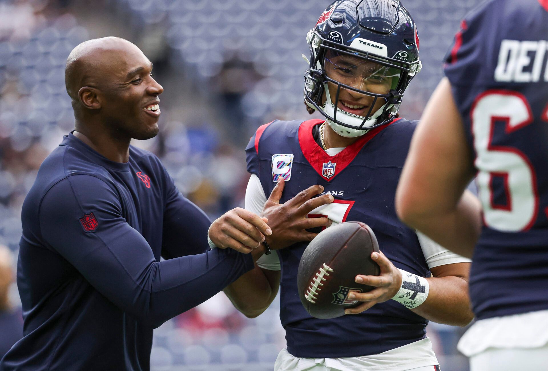 Houston Texans head coach DeMeco Ryans laughs with quarterback C.J. Stroud (7) before the game against the New Orleans Saints at NRG Stadium.