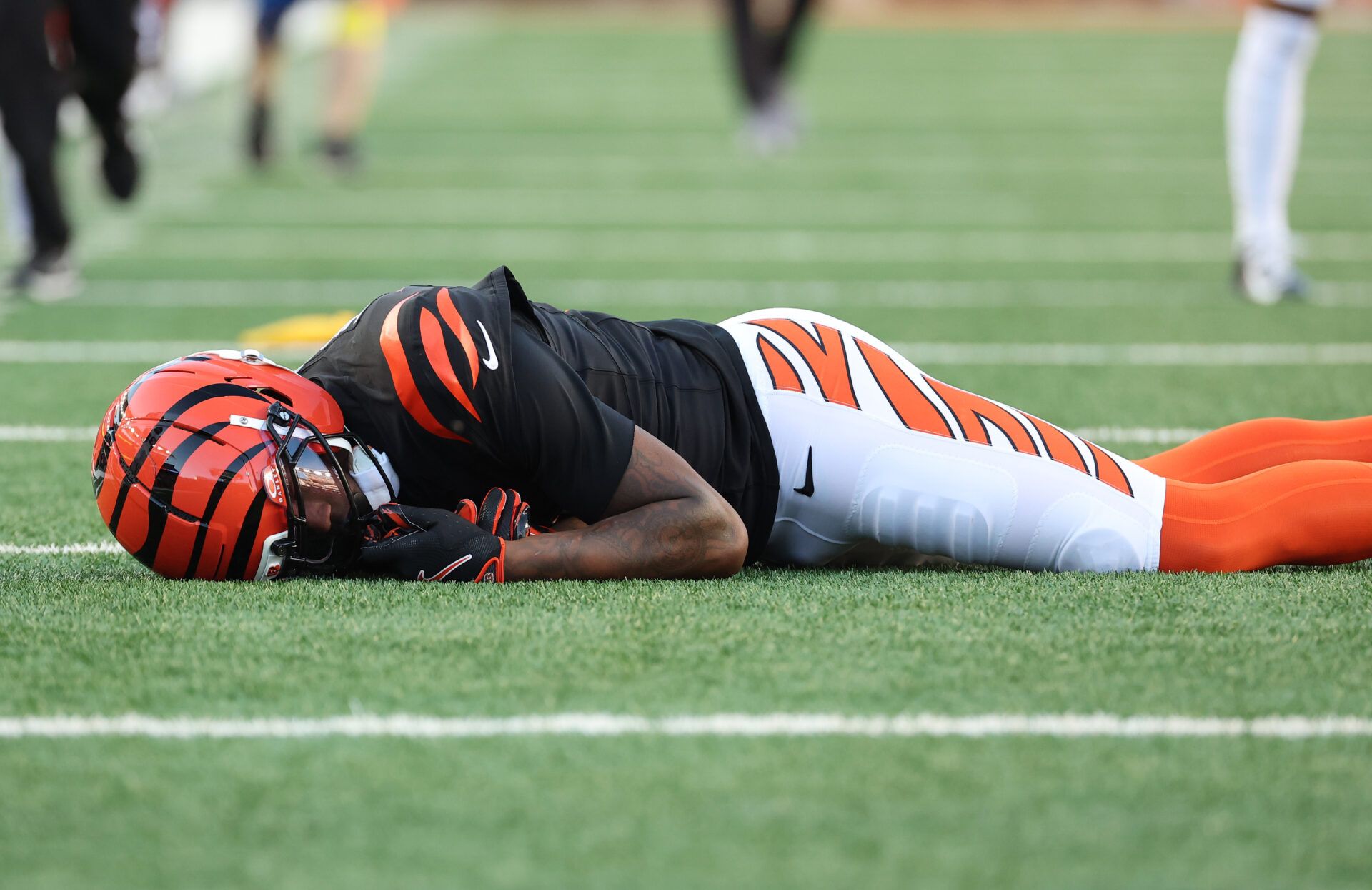 Cincinnati Bengals wide receiver Tee Higgins (5) is injured on a play during the second half against the New England Patriots at Paycor Stadium.