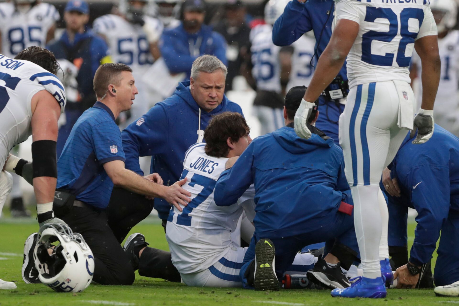 Indianapolis Colts quarterback Daniel Jones (17) is tended to by trainers after going down with an apparent injury against the Jacksonville Jaguars during the first half at EverBank Stadium.