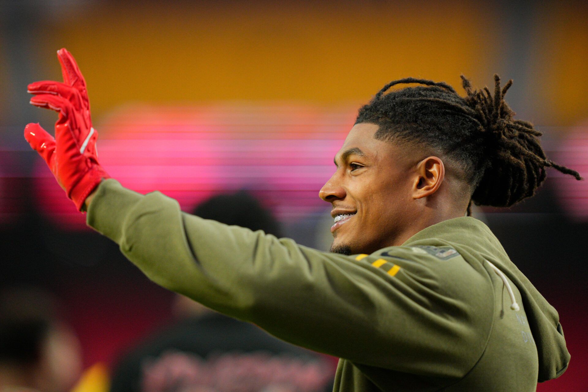 Kansas City Chiefs running back Isiah Pacheco (10) waves to fans during warmups prior to the game against the Washington Commanders at GEHA Field at Arrowhead Stadium.