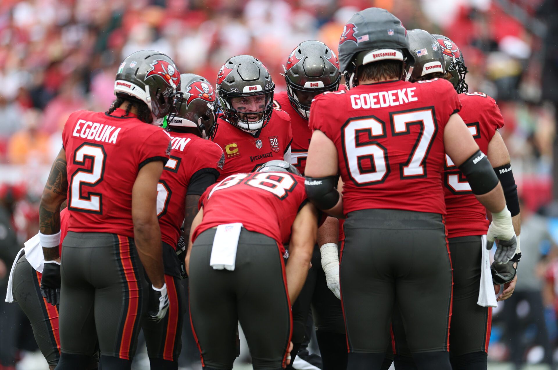 The Tampa Bay Buccaneers huddle during the first quarter against the New Orleans Saints at Raymond James Stadium.