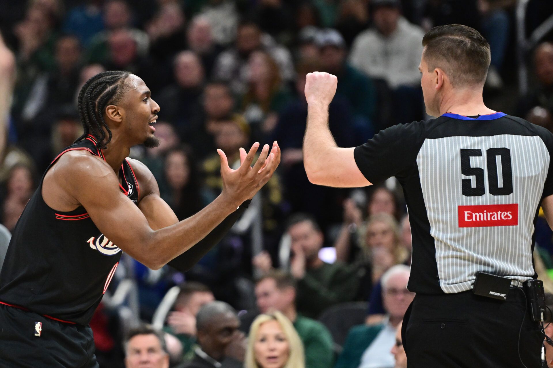 Philadelphia 76ers guard Tyrese Maxey (0) pleads a call to referee Gediminas Petraitis in the 4th quarter against the Milwaukee Bucks at Fiserv Forum.