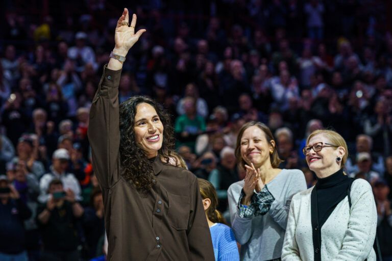 Former UConn Huskies player Sue Bird is honored with the retirement of her kersey number before the start of the game against the  watches from the sideline as they take on the UConn Huskies at Harry A. Gampel Pavilion.