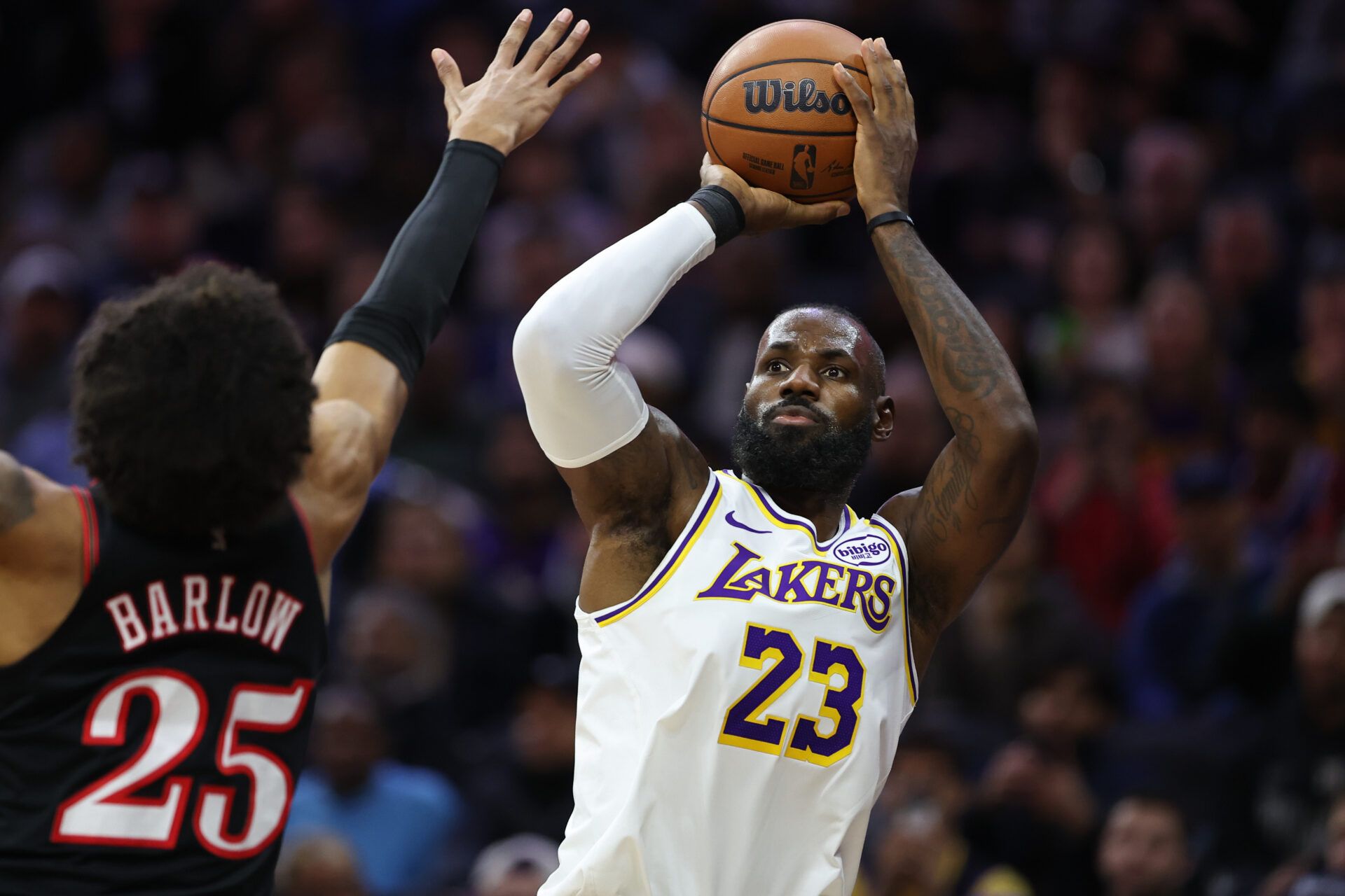 Los Angeles Lakers forward Lebron James (23) shoots past Philadelphia 76ers forward Dominick Barlow (25) during the first quarter at Xfinity Mobile Arena.
