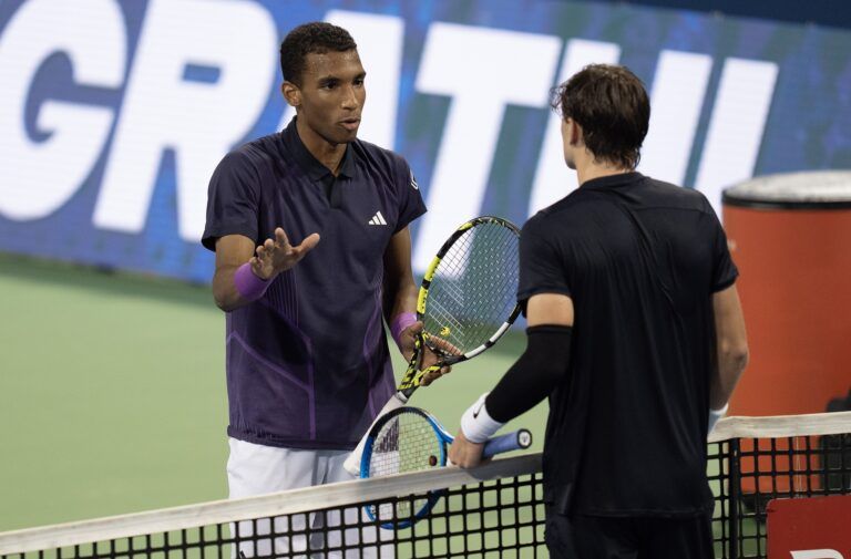 Felix Auger-Aliassime of Canada and Jack Draper of Great Britain meet at the net after a controversial match-ending point on Day 5 of the Cincinnati Open.