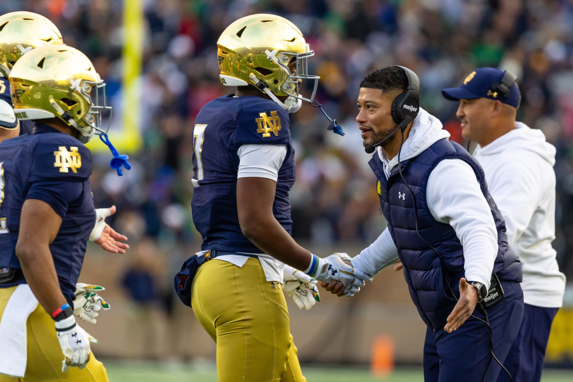 Notre Dame Fighting Irish head coach Marcus Freeman celebrates with player after a touchdown against the Syracuse Orange during the first half at Notre Dame Stadium.
