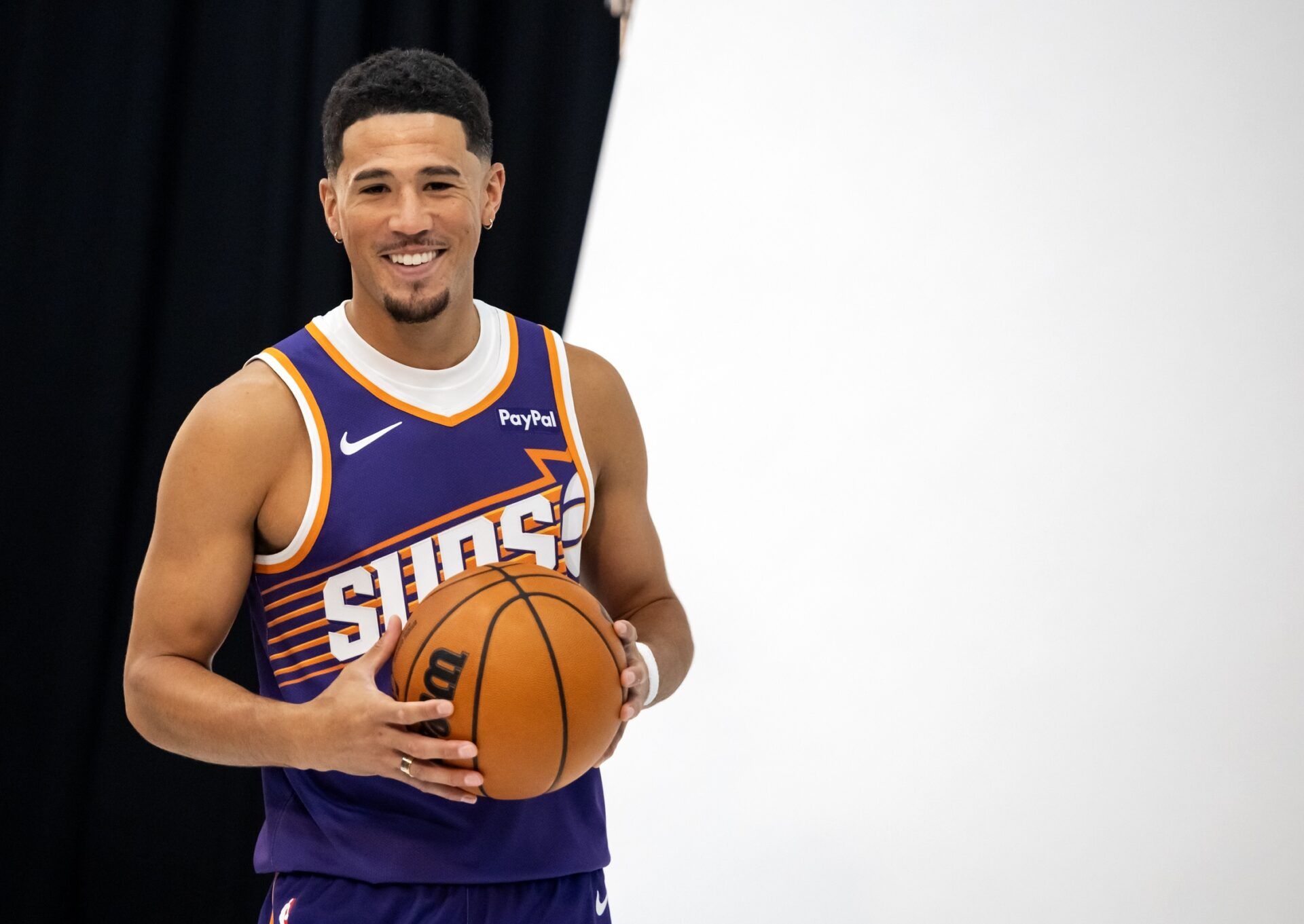 Phoenix Suns guard Devin Booker (1) poses for portrait during Media Day at PHX Arena.