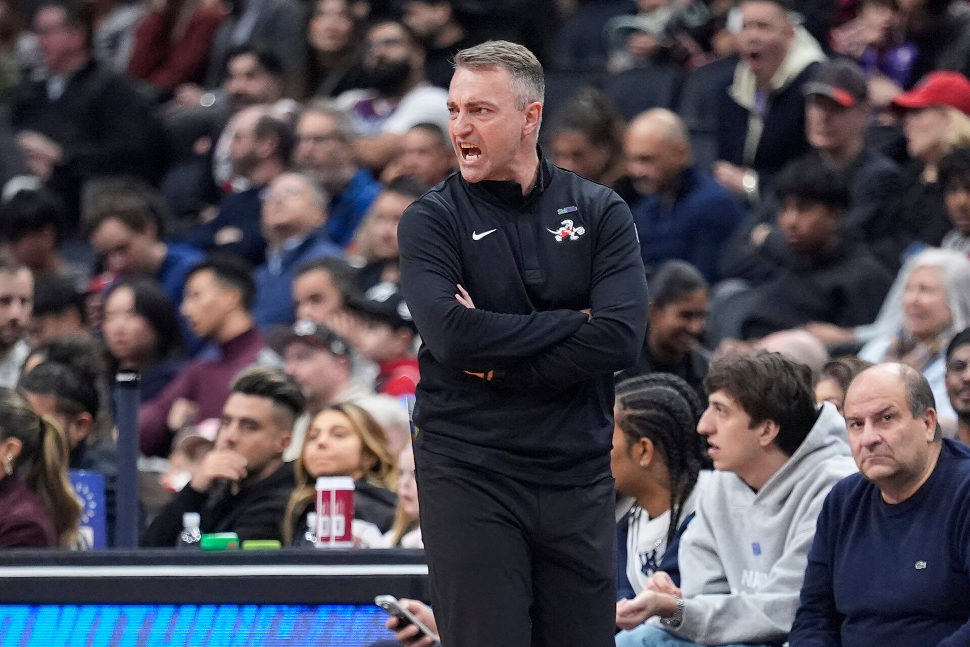 Toronto Raptors head coach Darko Rajakovic calls out to his team during the first half against the Boston Celtics at Scotiabank Arena.