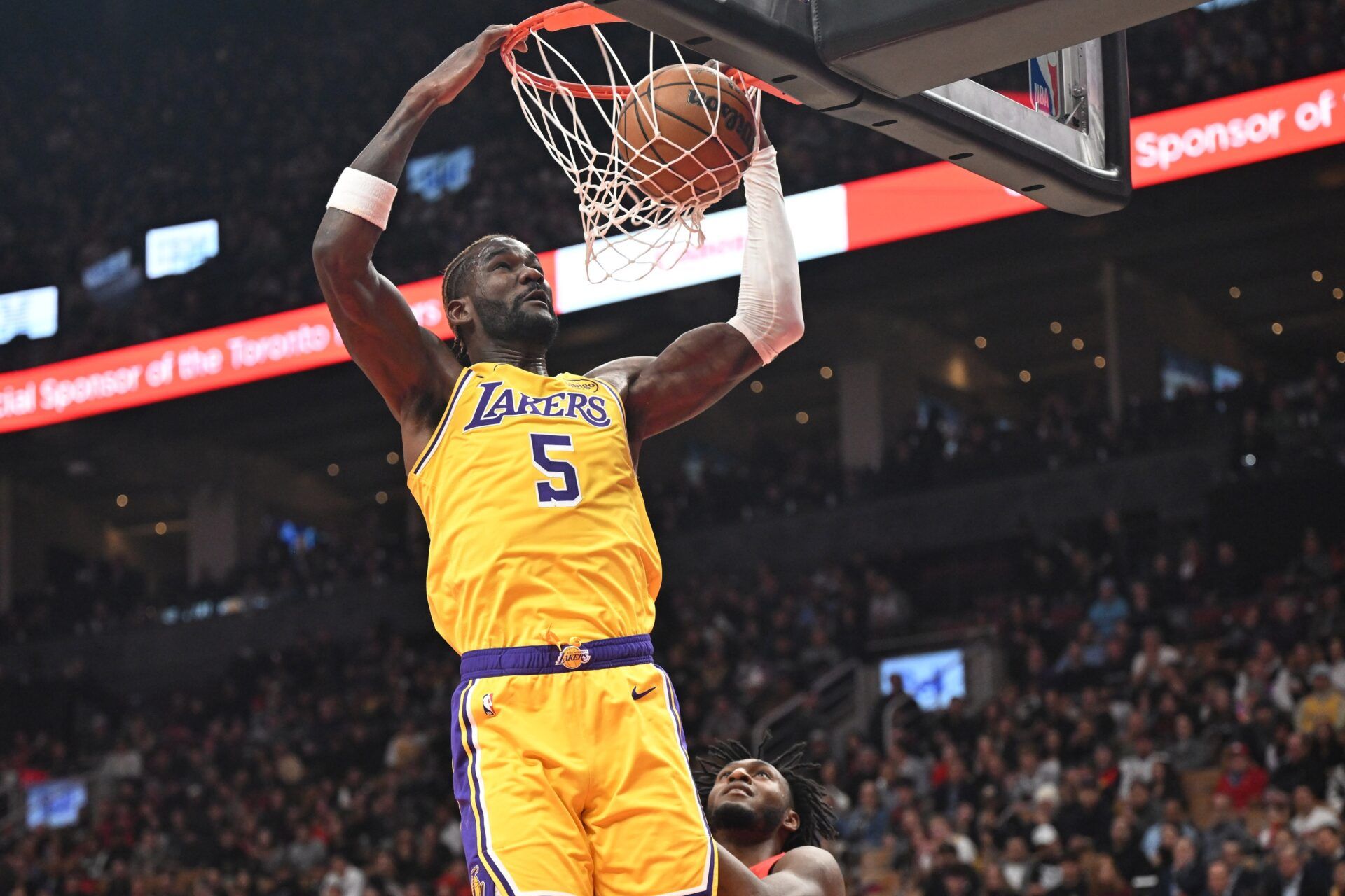 Los Angeles Lakers center Deandre Ayton (5) dunks for a basket over Toronto Raptors guard Immanuel Quickley (5) in the first half at Scotiabank Arena.