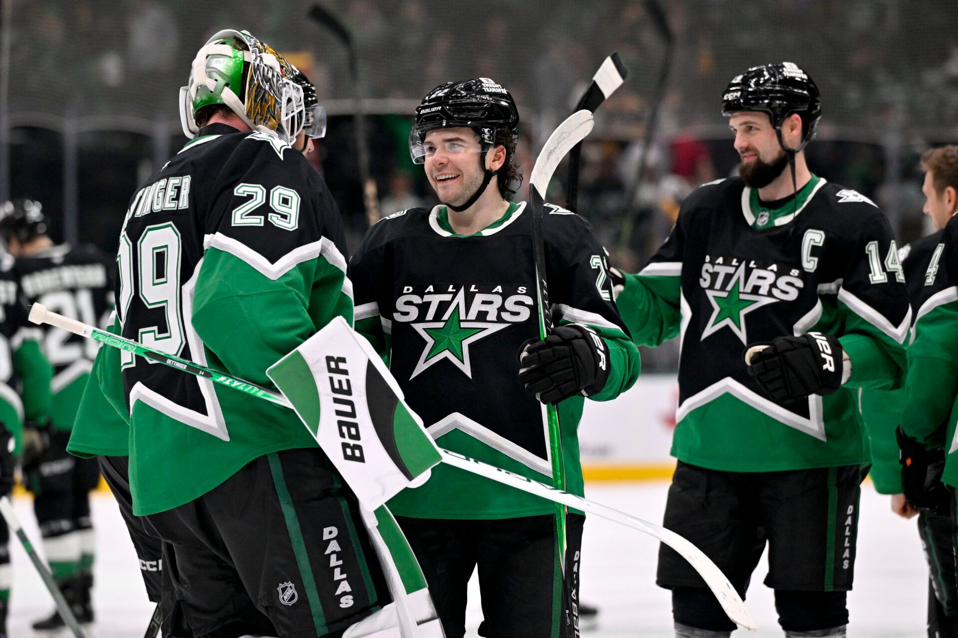 Dallas Stars goaltender Jake Oettinger (29) and center Mavrik Bourque (22) and left wing Jamie Benn (14) celebrate after the Stars defeat the Pittsburgh Penguins at American Airlines Center.