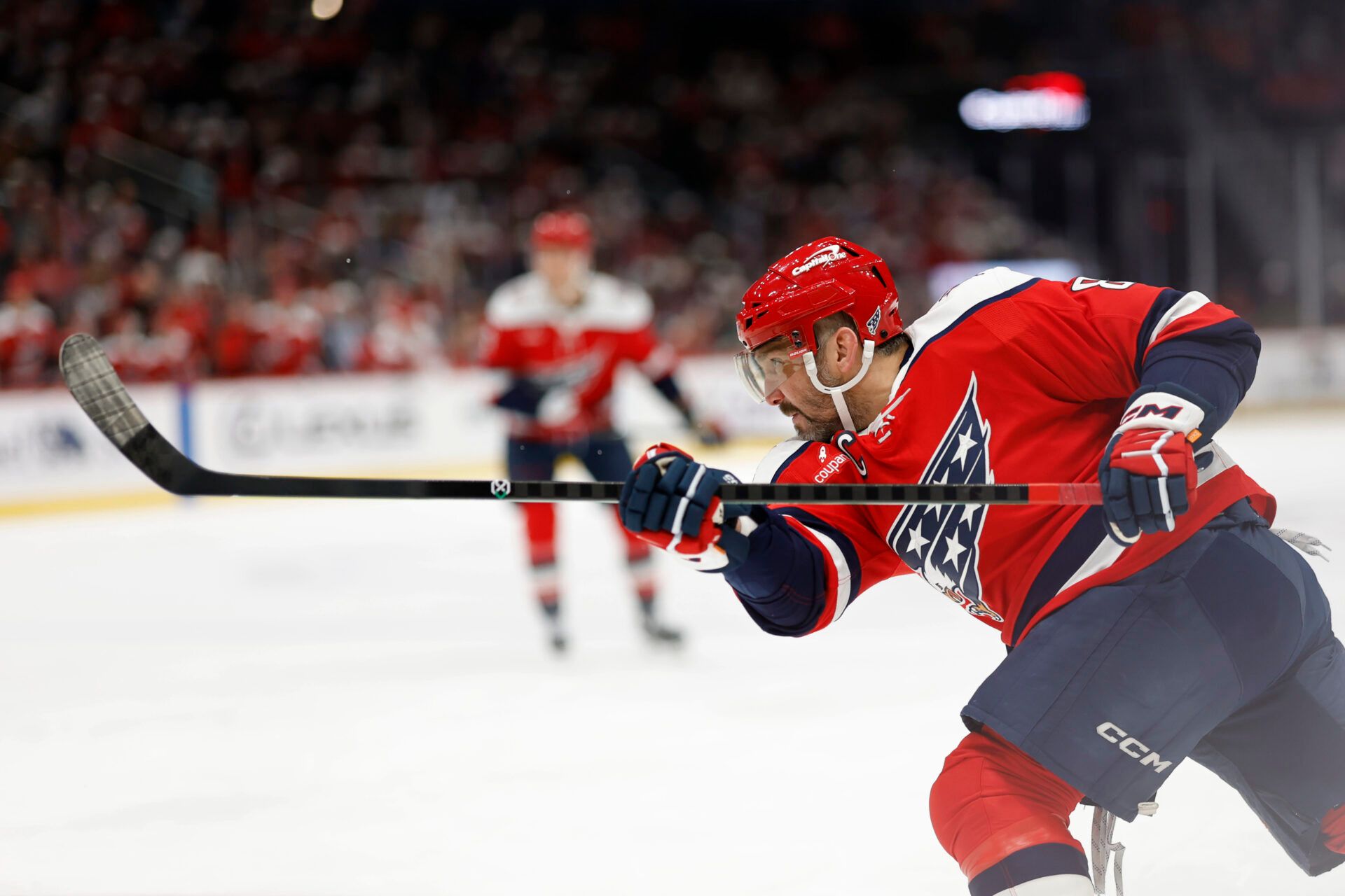 Washington Capitals left wing Alex Ovechkin (8) shoots the puck against the Columbus Blue Jackets during the third period at Capital One Arena.