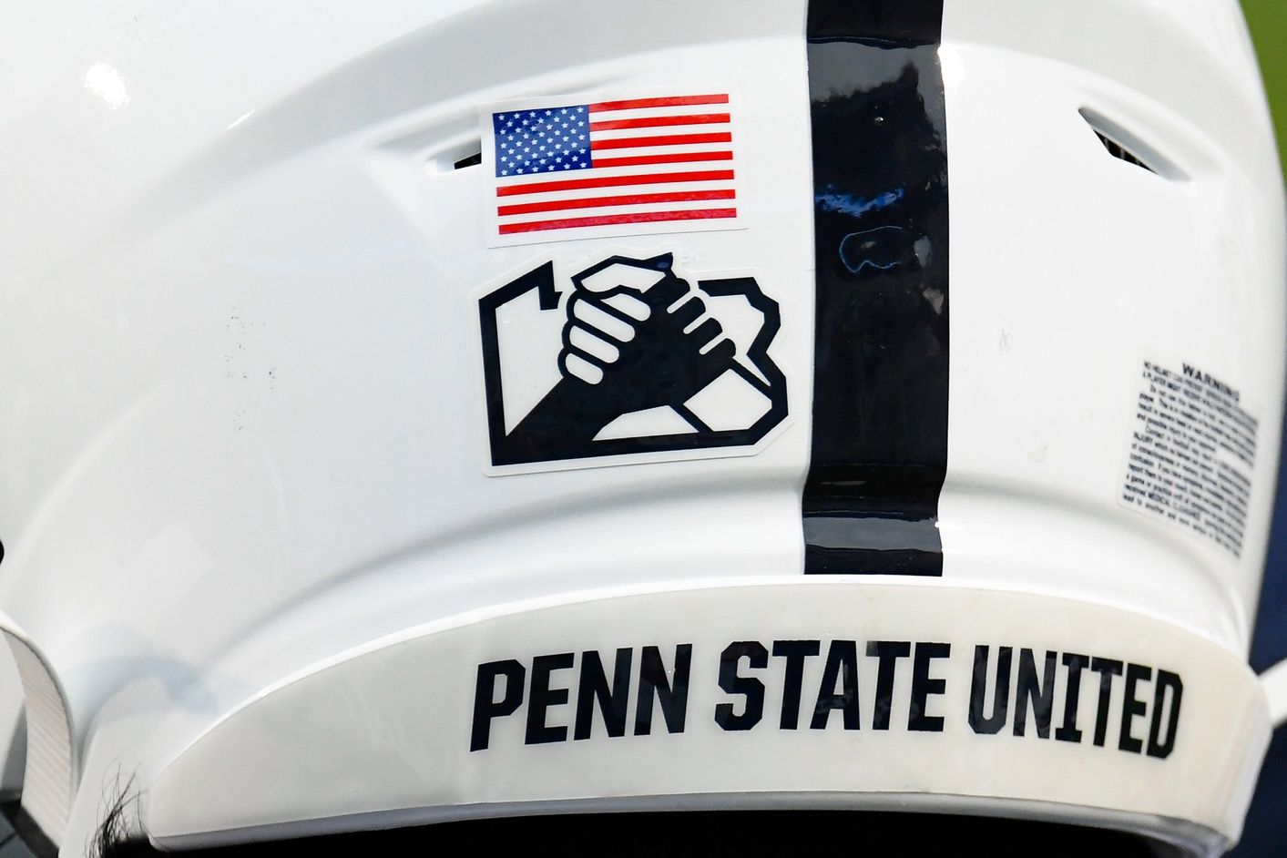 Detailed view of the Penn State Nittany Lions Unity logo on a helmet prior to the game against the Iowa Hawkeyes at Beaver Stadium.