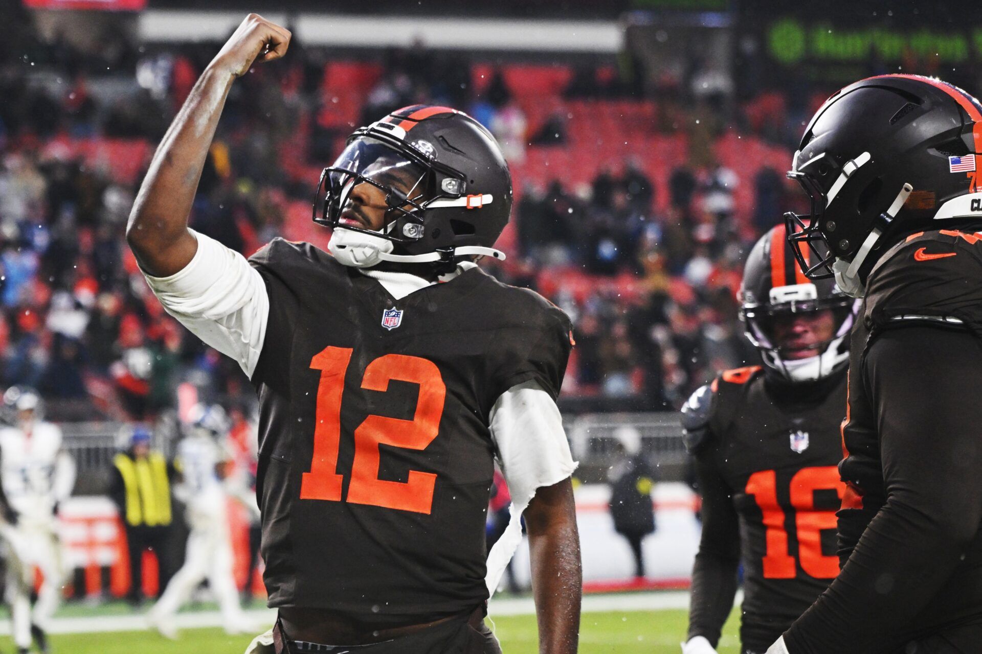 Cleveland Browns quarterback Shedeur Sanders (12) celebrates after scoring a touchdown against the Tennessee Titans during the fourth quarter at Huntington Bank Field.