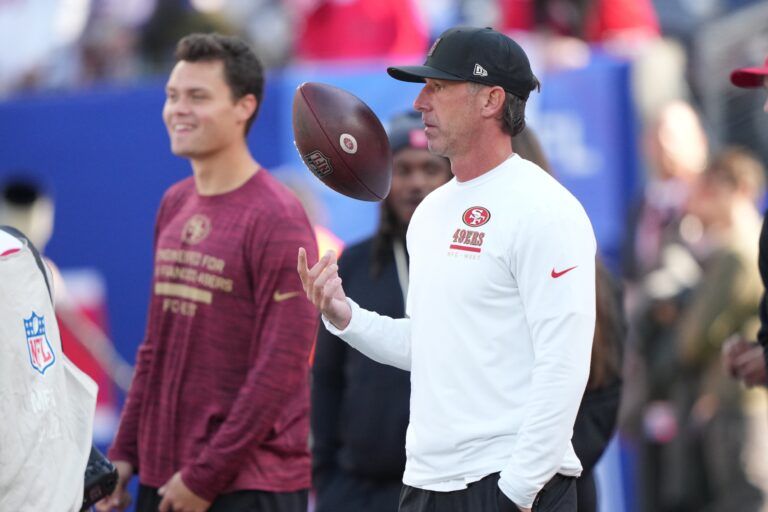 San Francisco 49ers head coach Kyle Shanahan tosses a football in the air during warm ups prior to a game against the New York Giants at MetLife Stadium.