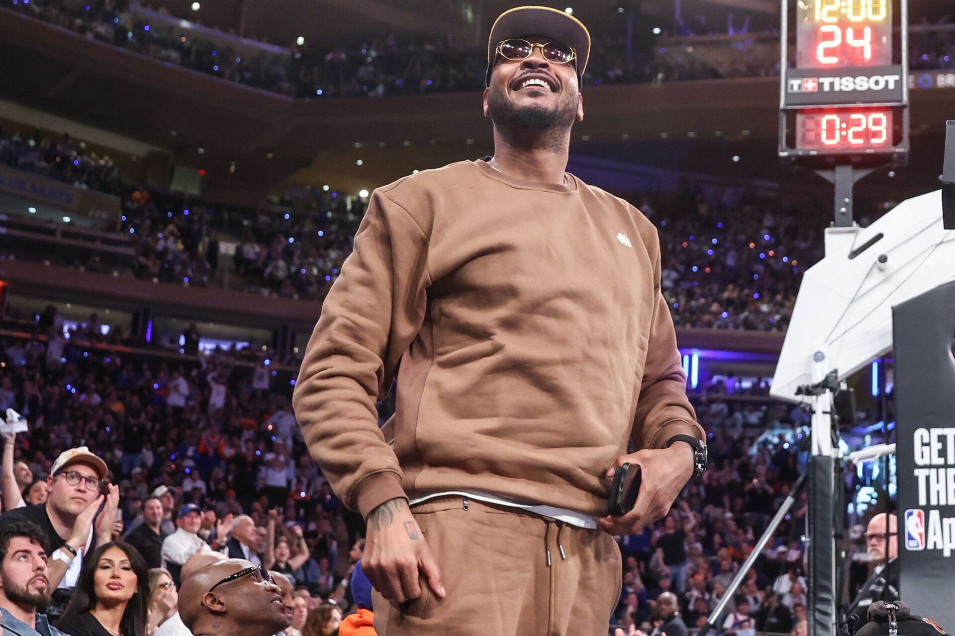 Former NBA forward Carmelo Anthony waves to the crowd during game five of first round for the 2025 NBA Playoffs between the against the Detroit Pistons and the New York Knicks at Madison Square Garden.