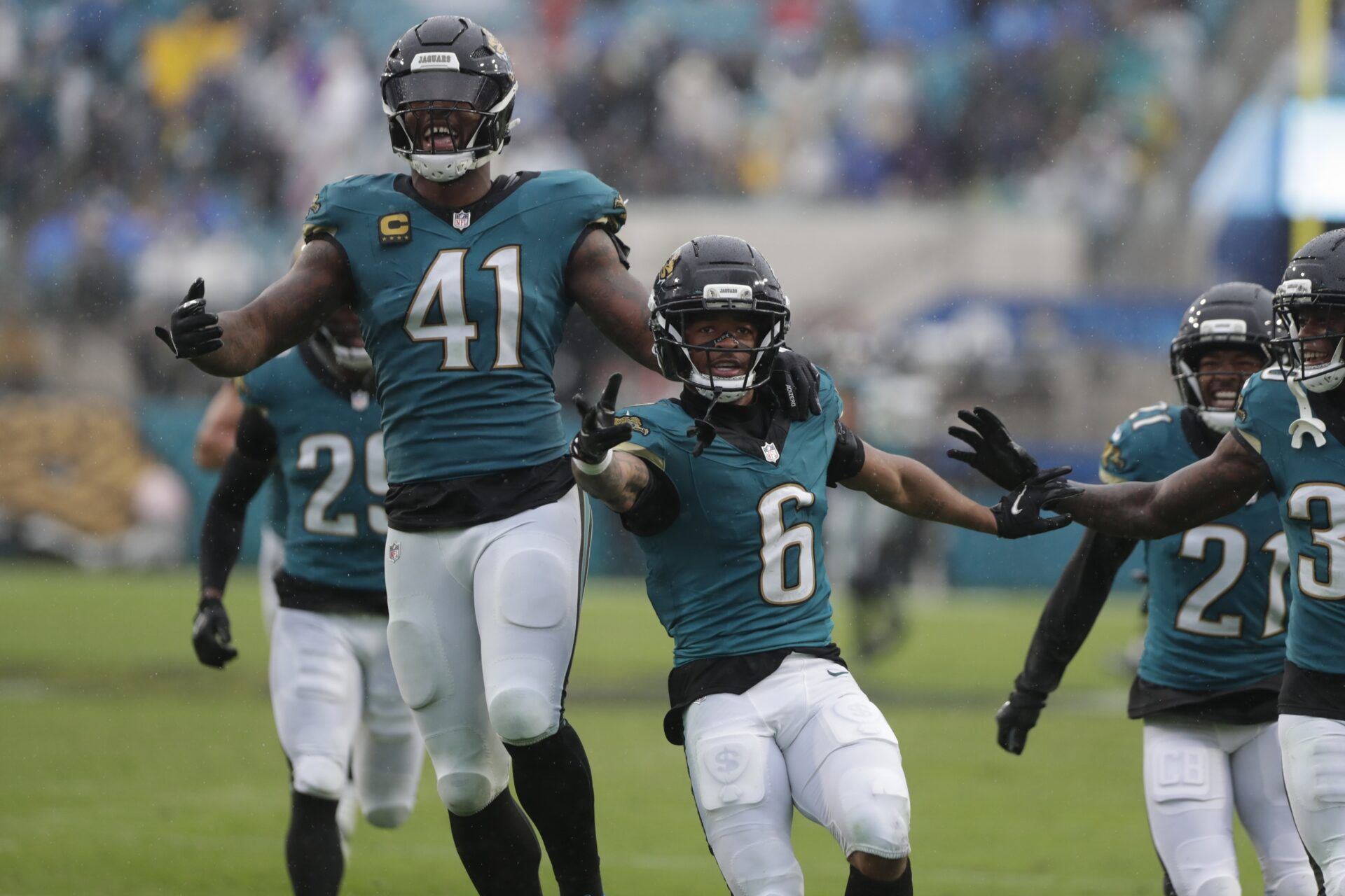 Jacksonville Jaguars cornerback Greg Newsome II (6) reacts with defensive end Josh Hines-Allen (41) after making an interception against the Indianapolis Colts during the second half at EverBank Stadium.