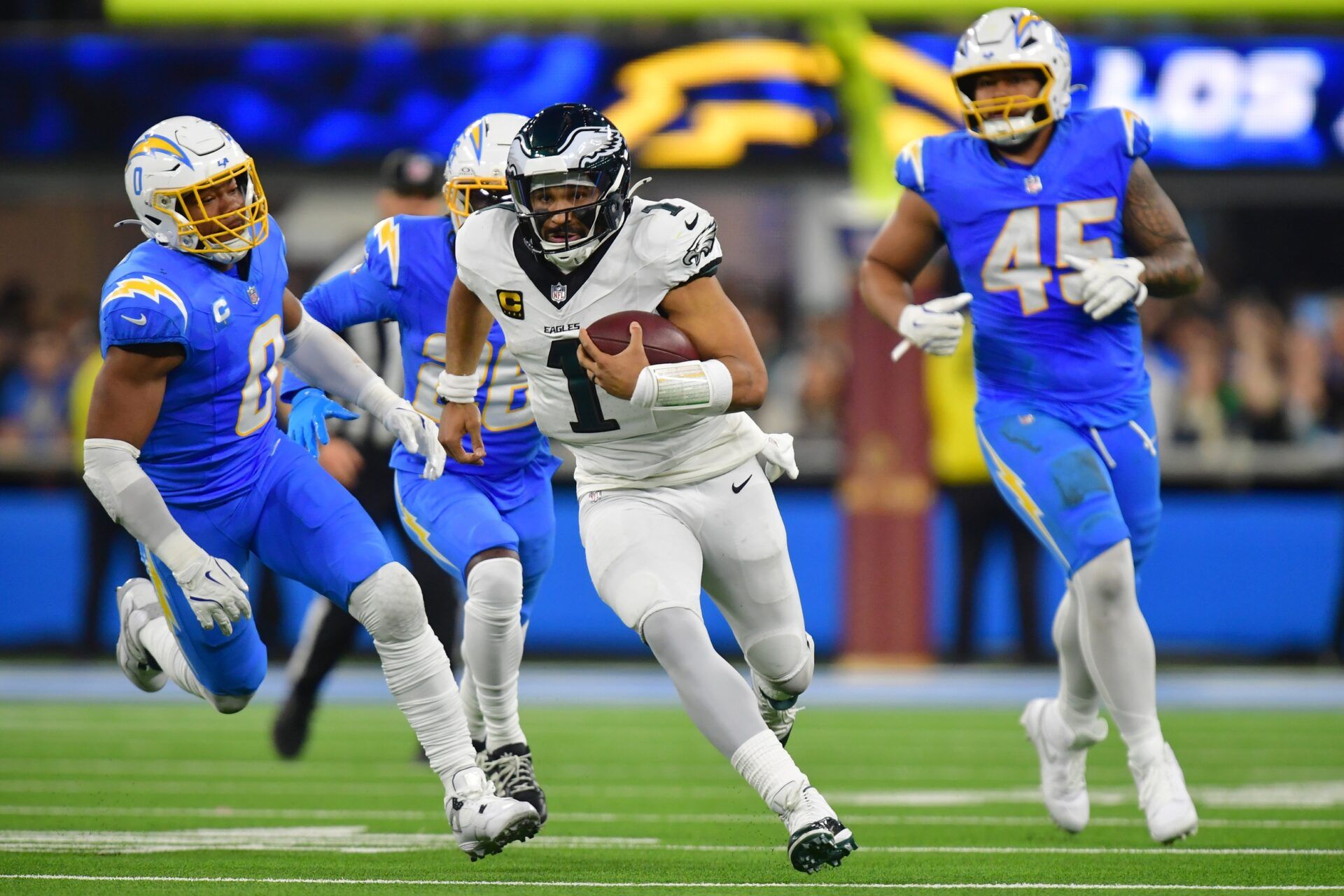 Philadelphia Eagles quarterback Jalen Hurts (1) runs against the Los Angeles Chargers in the overtime at SoFi Stadium.
